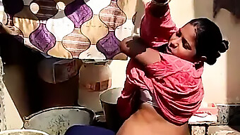 A Pregnant Indian Girl From A Rural Community Takes A Bath Outside